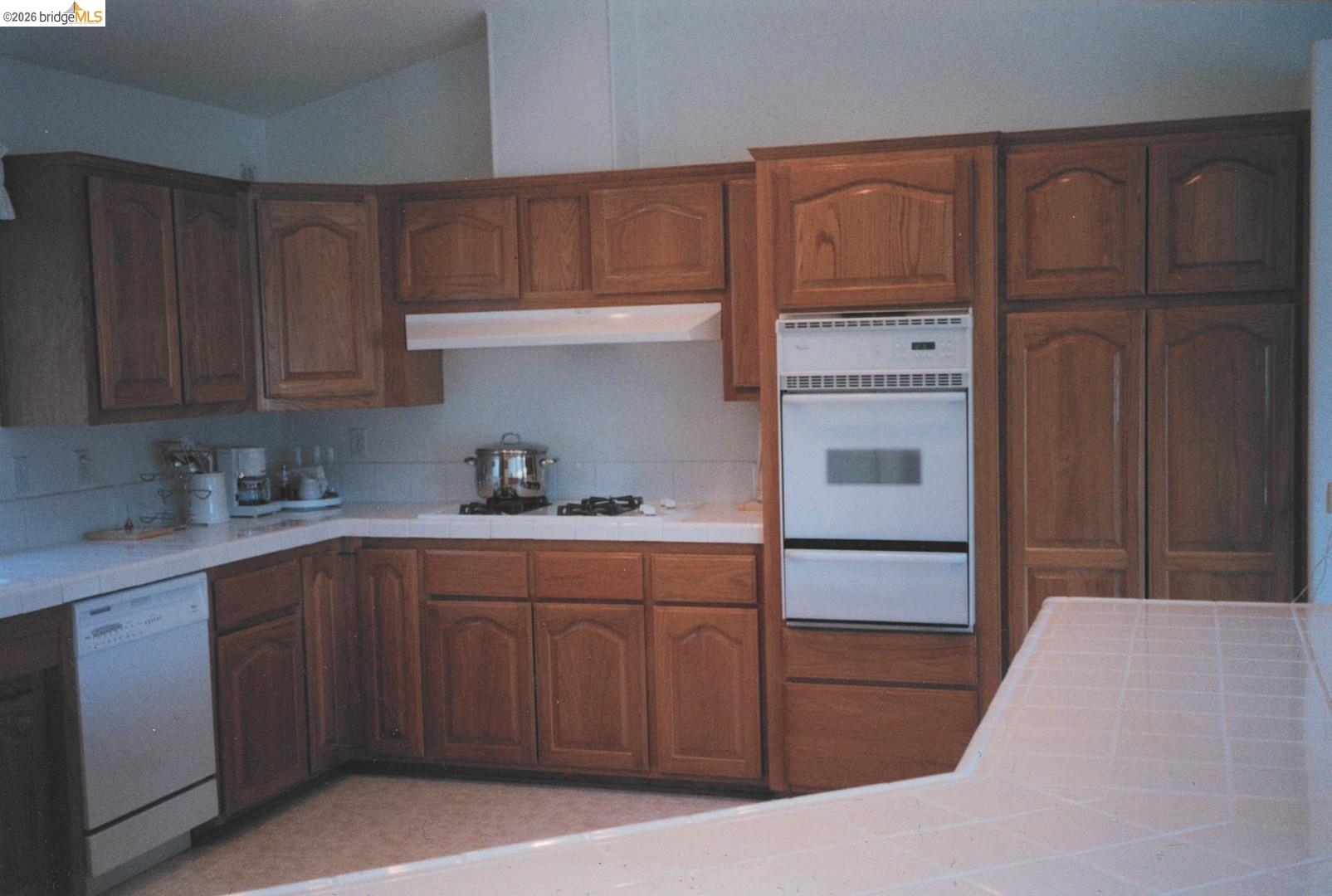 4001 Branscomb Road Laytonville, CA 95454 - Photo 9 of 28 a kitchen with a sink a stove and cabinets