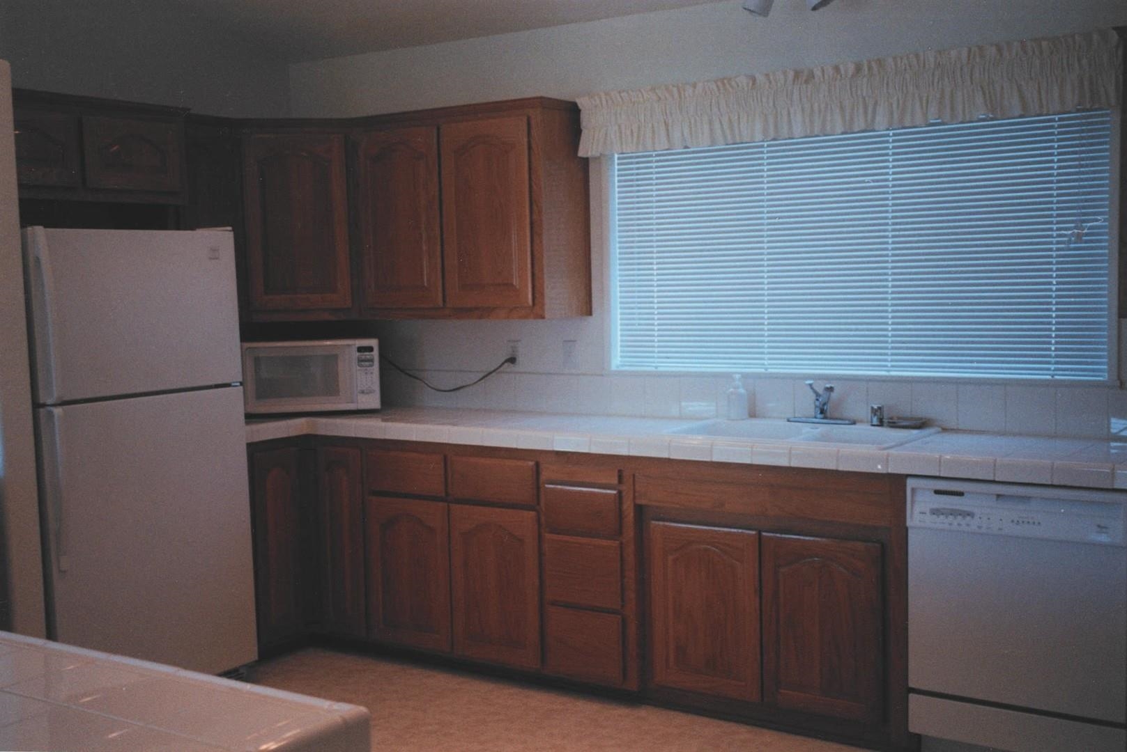 4001 Branscomb Road Laytonville, CA 95454 - Photo 10 of 28 a kitchen with a sink and refrigerator