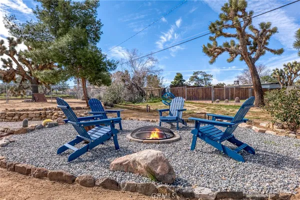 a view of a backyard with sitting area