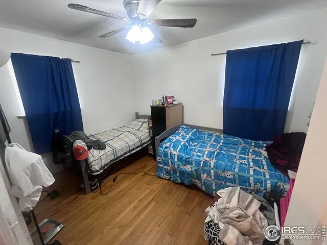 a bedroom with bed and a window