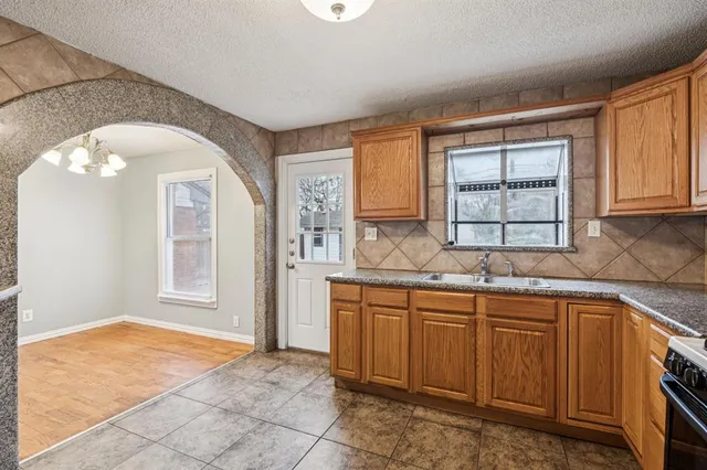 a kitchen with a sink and cabinets