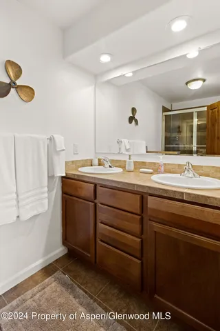 a room with a mirror and a sink