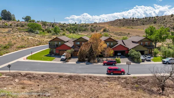a view of a house with a road