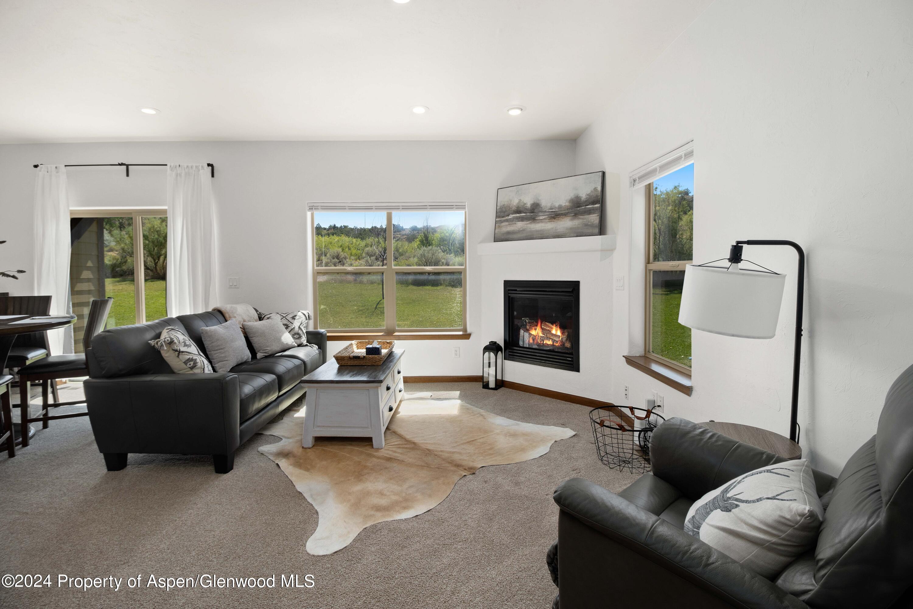 Rifle Proper Rifle, CO 81650 - Photo 9 of 23 a living room with furniture and a fireplace