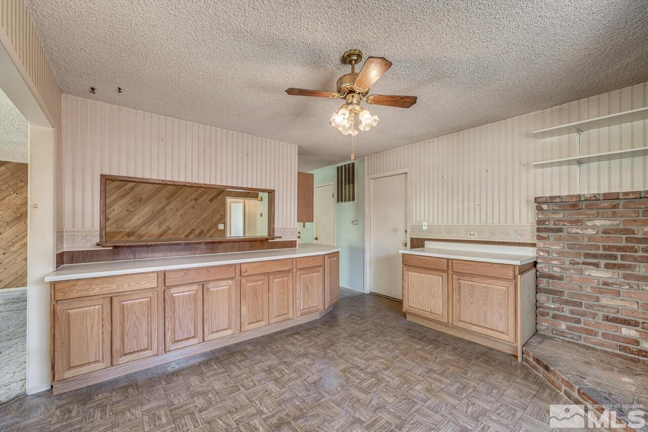 1885 Kings Row Reno, NV 89503 - Photo 11 of 39 a kitchen with granite countertop a sink and a stove top oven