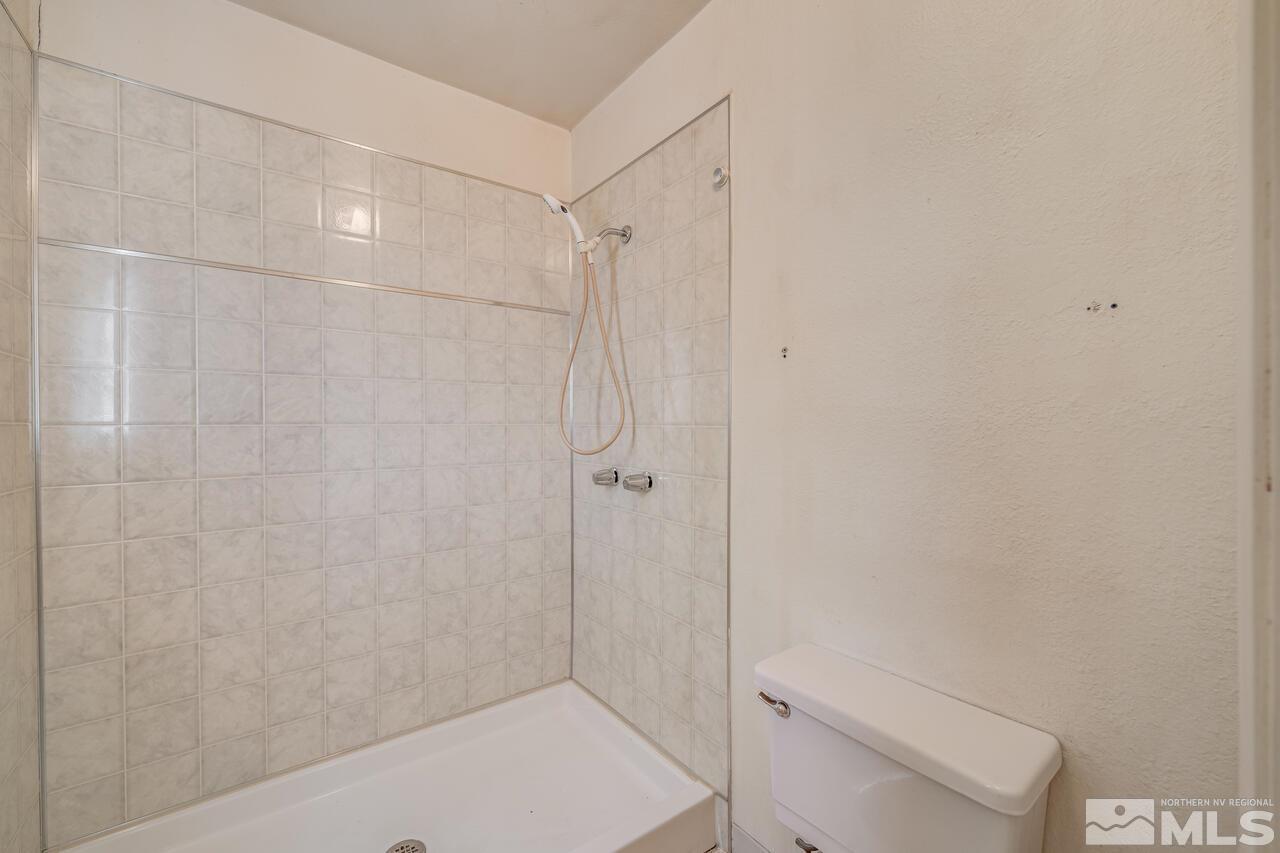 1885 Kings Row Reno, NV 89503 - Photo 25 of 39 a bathroom with a shower and a toilet