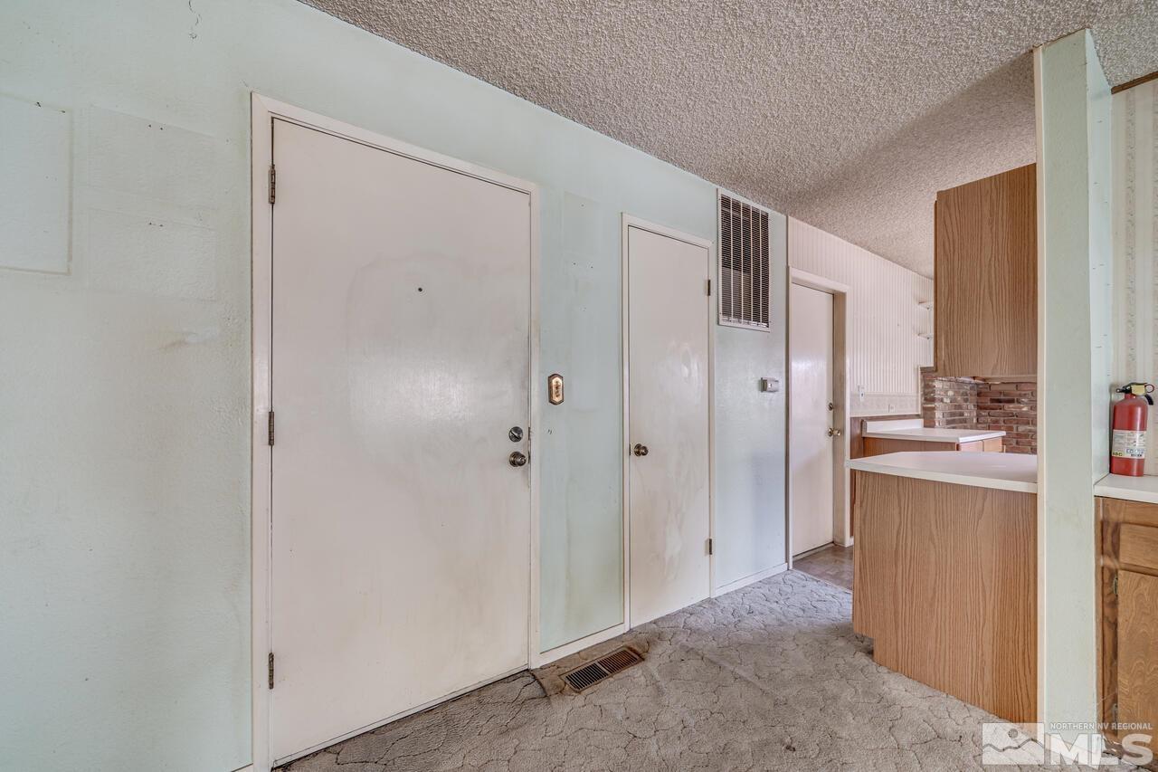 1885 Kings Row Reno, NV 89503 - Photo 4 of 39 a view of kitchen with granite countertop cabinets refrigerator and stove