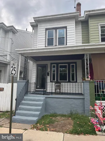 a view of a house with a window and stairs