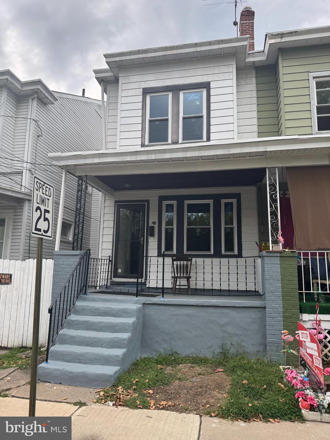 a view of a house with a window and stairs