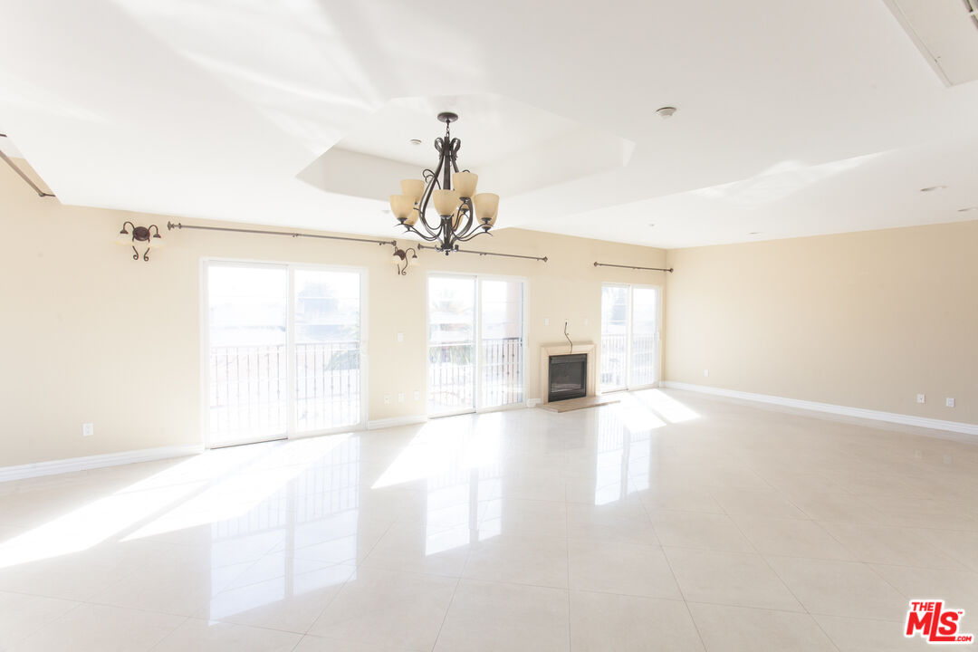 8555 Cashio Street, Unit PH4 Los Angeles, CA 90035 - Photo 4 of 43 a view of a kitchen with a sink and a window