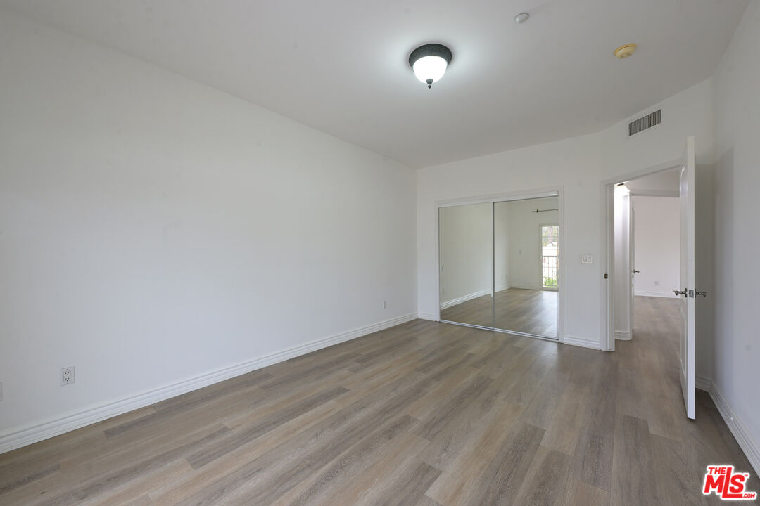 8555 Cashio Street, Unit PH4 Los Angeles, CA 90035 - Photo 43 of 43 wooden floor in an empty room