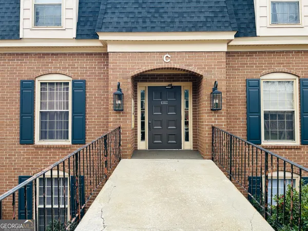 a kitchen with a refrigerator a stove a sink and cabinets