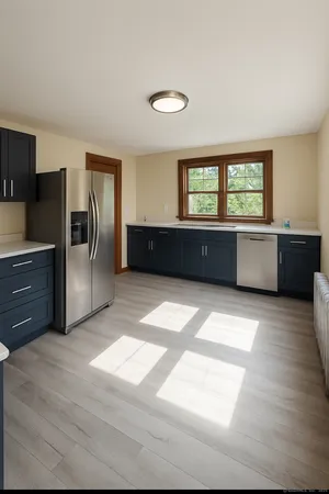 a large kitchen with a window and stainless steel appliances