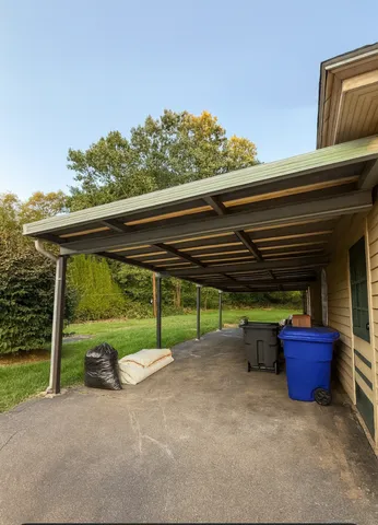 a backyard of a house with barbeque oven