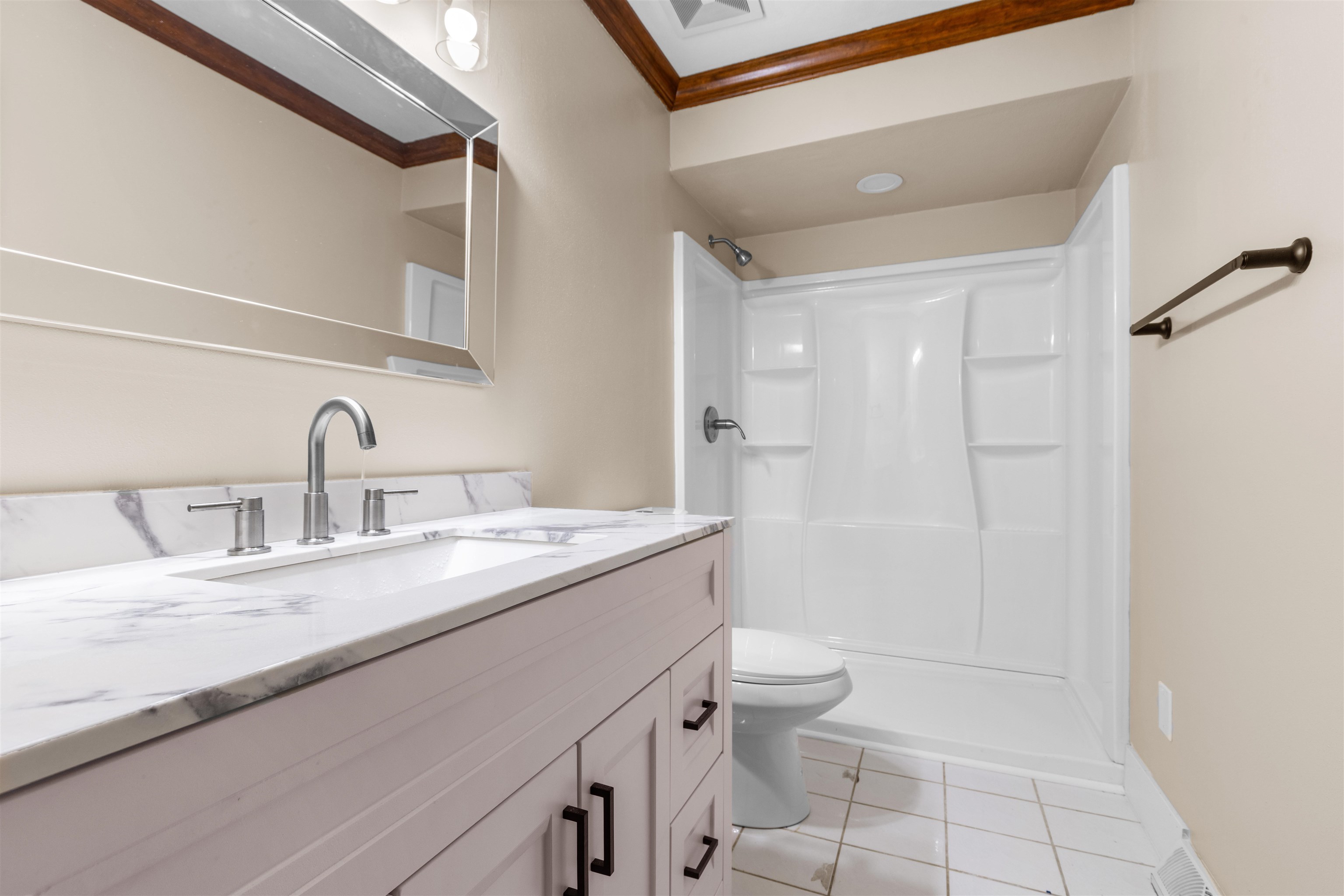 11738 Southgate Road Roscoe, IL 61073 - Photo 14 of 27 a bathroom with a granite countertop sink a toilet and shower