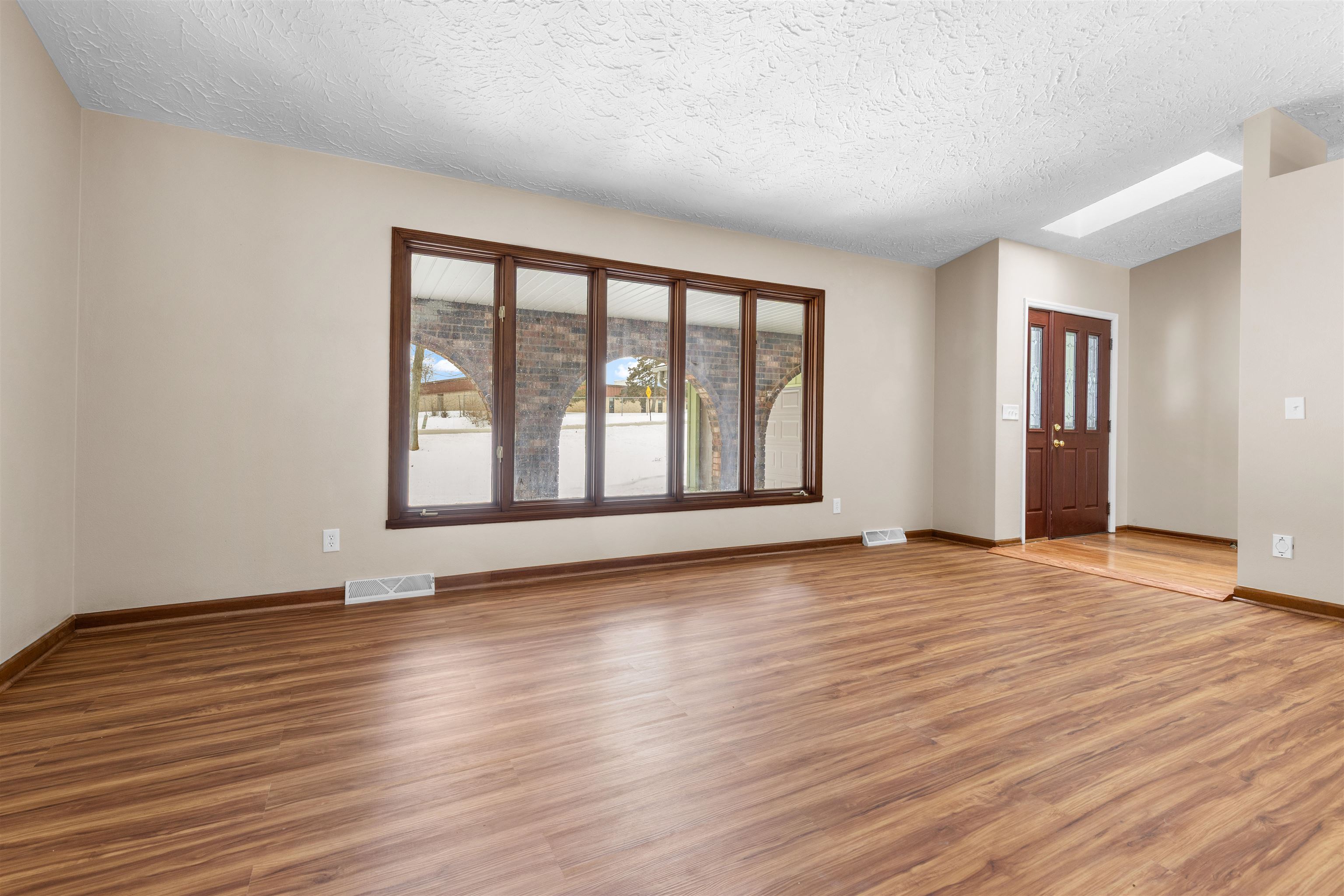 11738 Southgate Road Roscoe, IL 61073 - Photo 27 of 27 a view of an empty room with wooden floor and a window