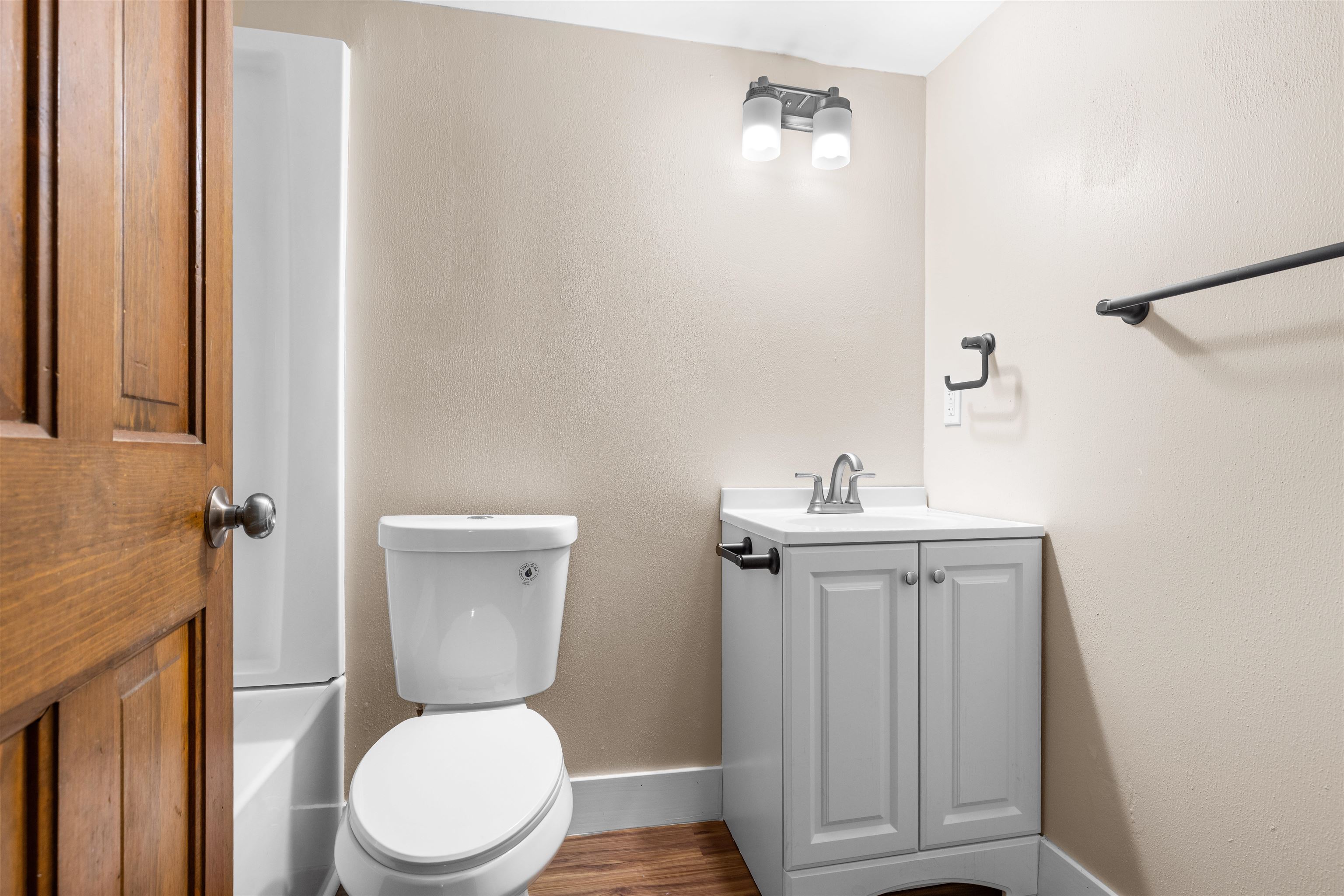 11738 Southgate Road Roscoe, IL 61073 - Photo 5 of 27 a white toilet sitting next to a bathroom sink