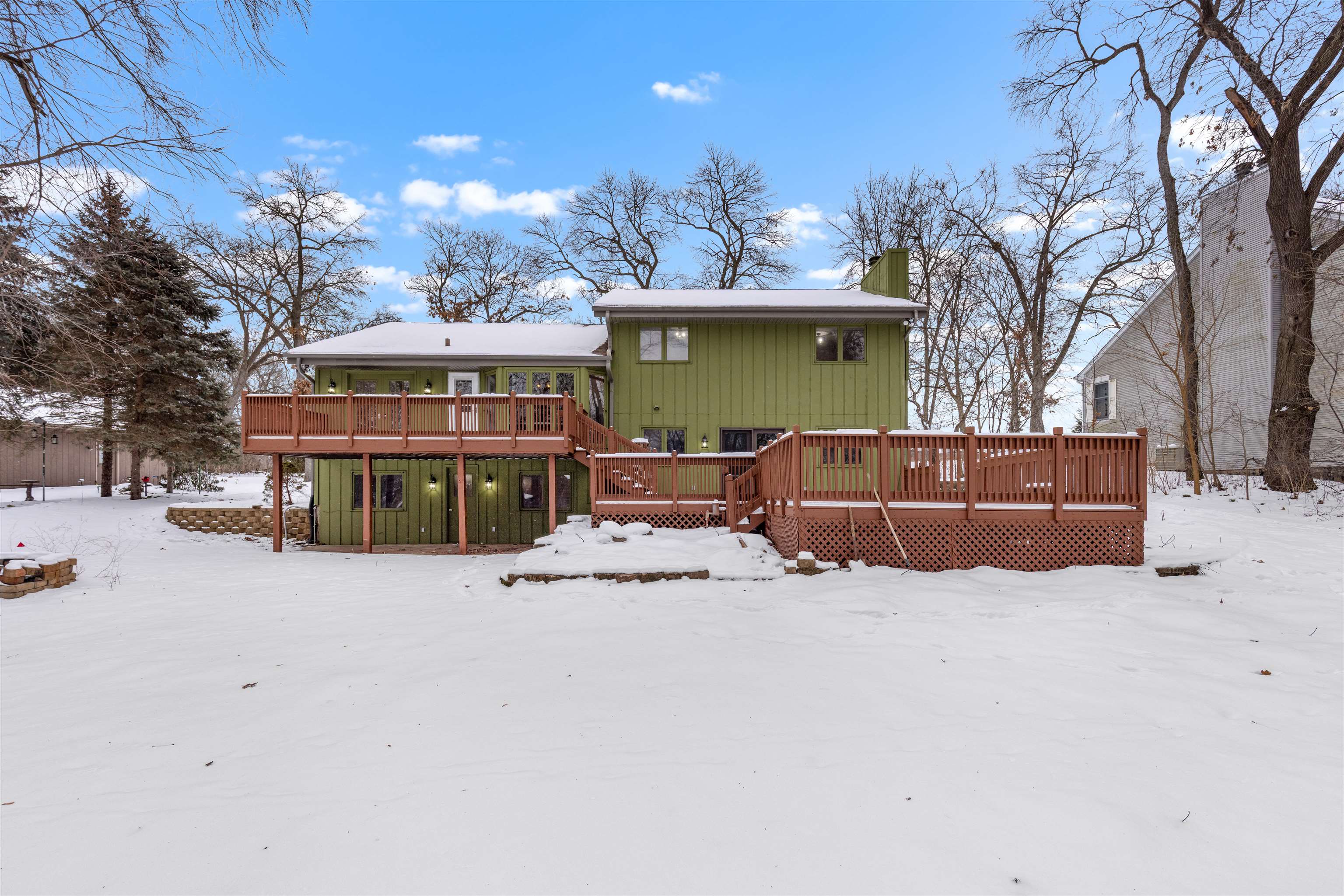 11738 Southgate Road Roscoe, IL 61073 - Photo 8 of 27 a view of a house with a yard covered in snow