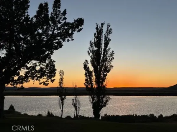 a view of a lake with a yard