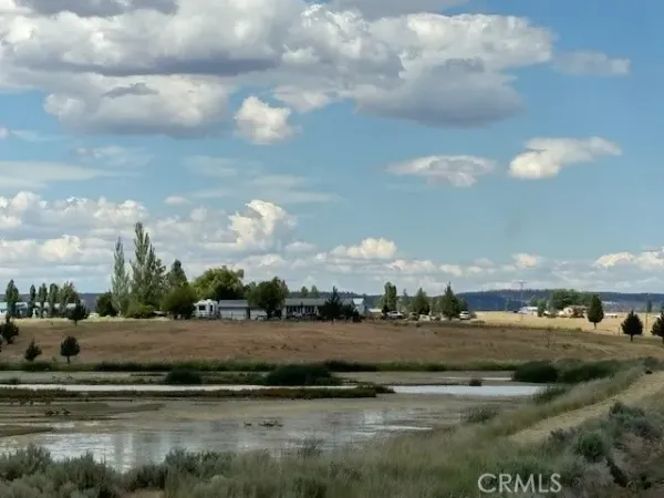a view of a lake with a big yard