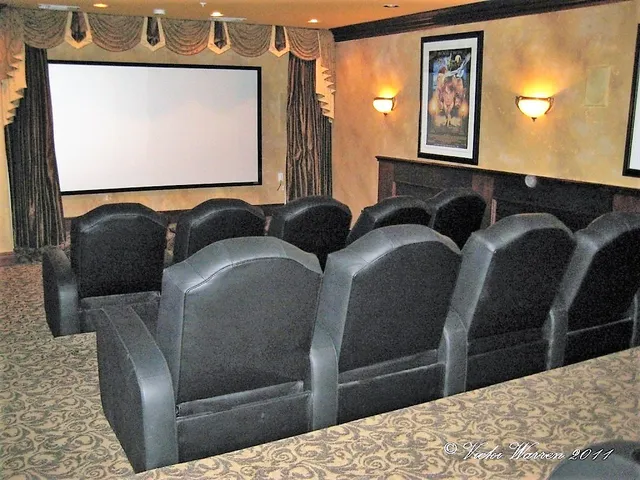 a bedroom with two beds and a dresser