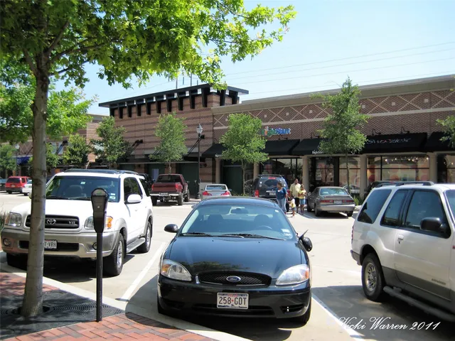 a view of a car parked in front of a house