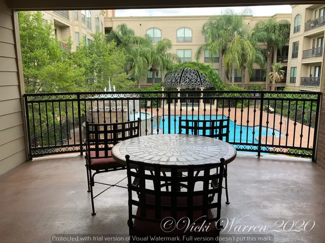 a view of a chairs and table in patio