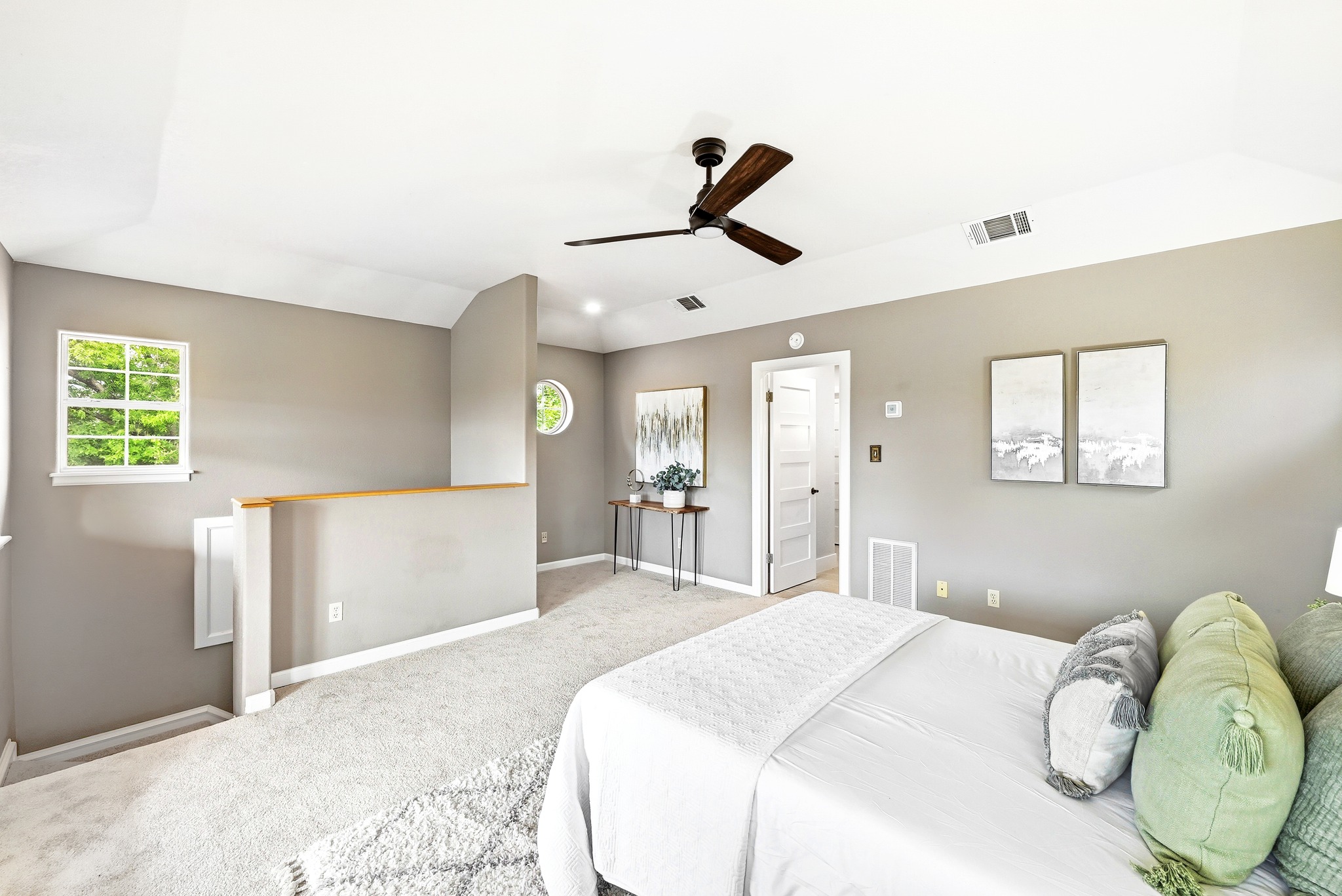 2405 Bahama Road Austin, TX 78733 - Photo 23 of 39 a bedroom with a bed and a chandelier