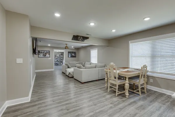 a view of a dining room with furniture and wooden floor