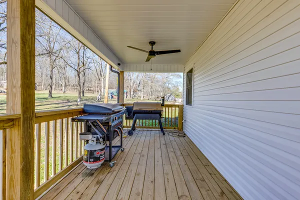 a view of a balcony with wooden floor