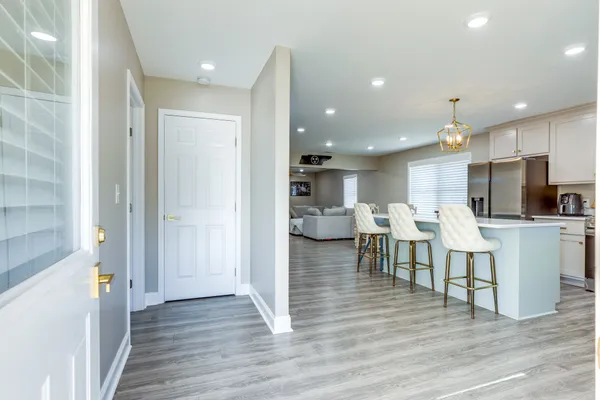 a kitchen with a sink a counter top space and stainless steel appliances