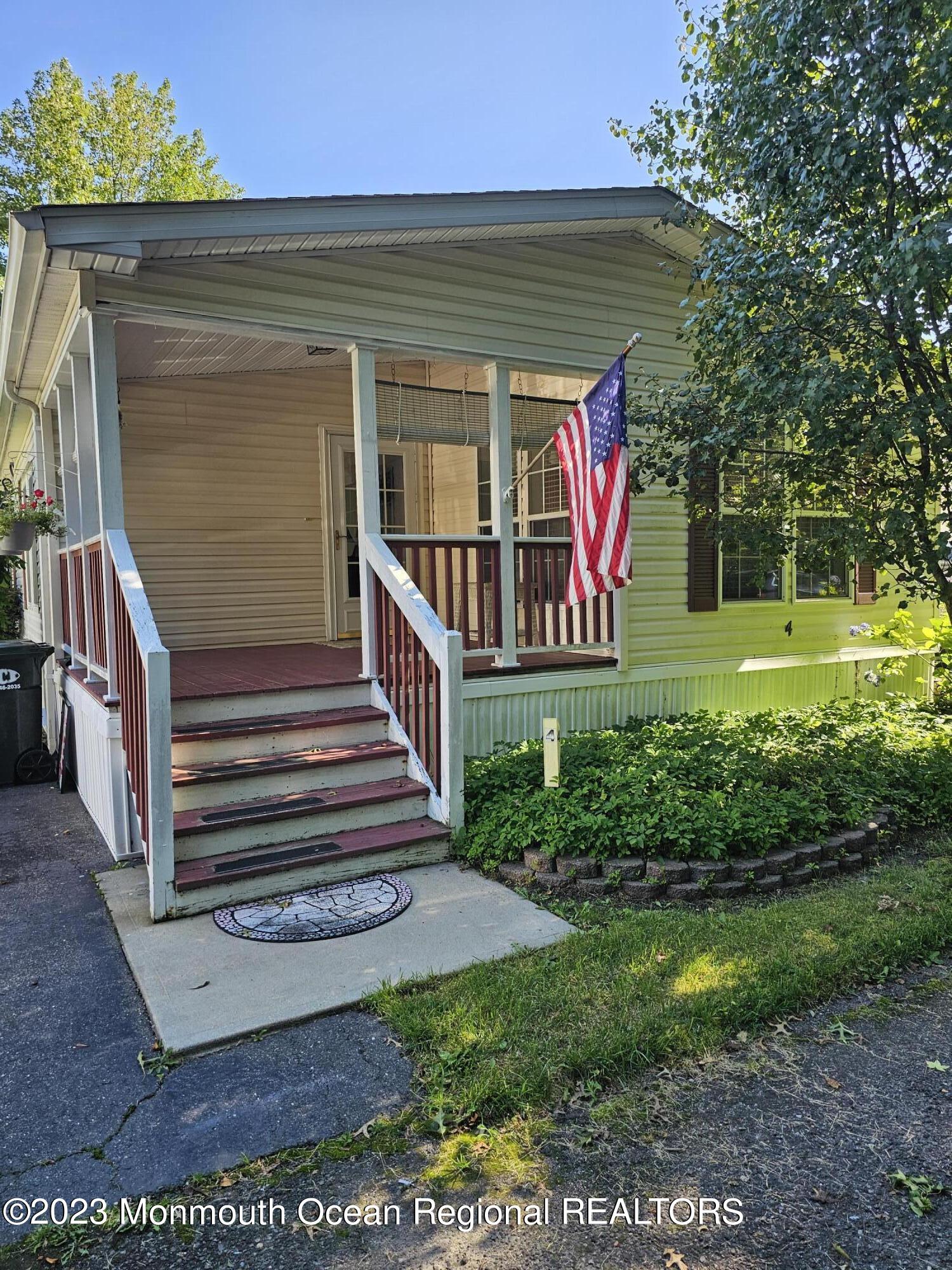4 Village Road Morganville, NJ 07751 - Photo 5 of 34 a front view of a house with garden