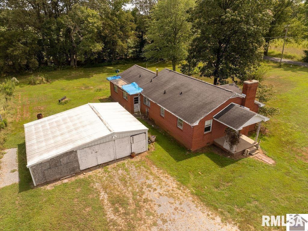 5465 Noble Road Paducah, KY 42001 - Photo 26 of 60 an aerial view of a house with swimming pool and large trees