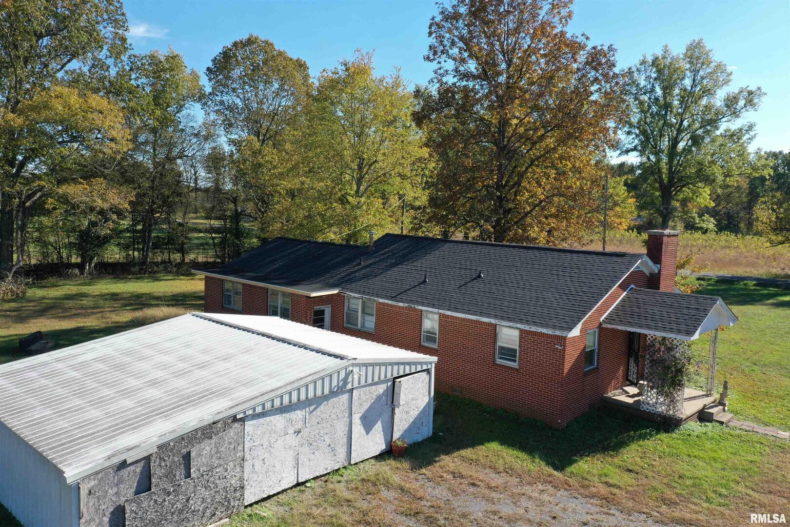 5465 Noble Road Paducah, KY 42001 - Photo 45 of 60 an aerial view of a house with a yard