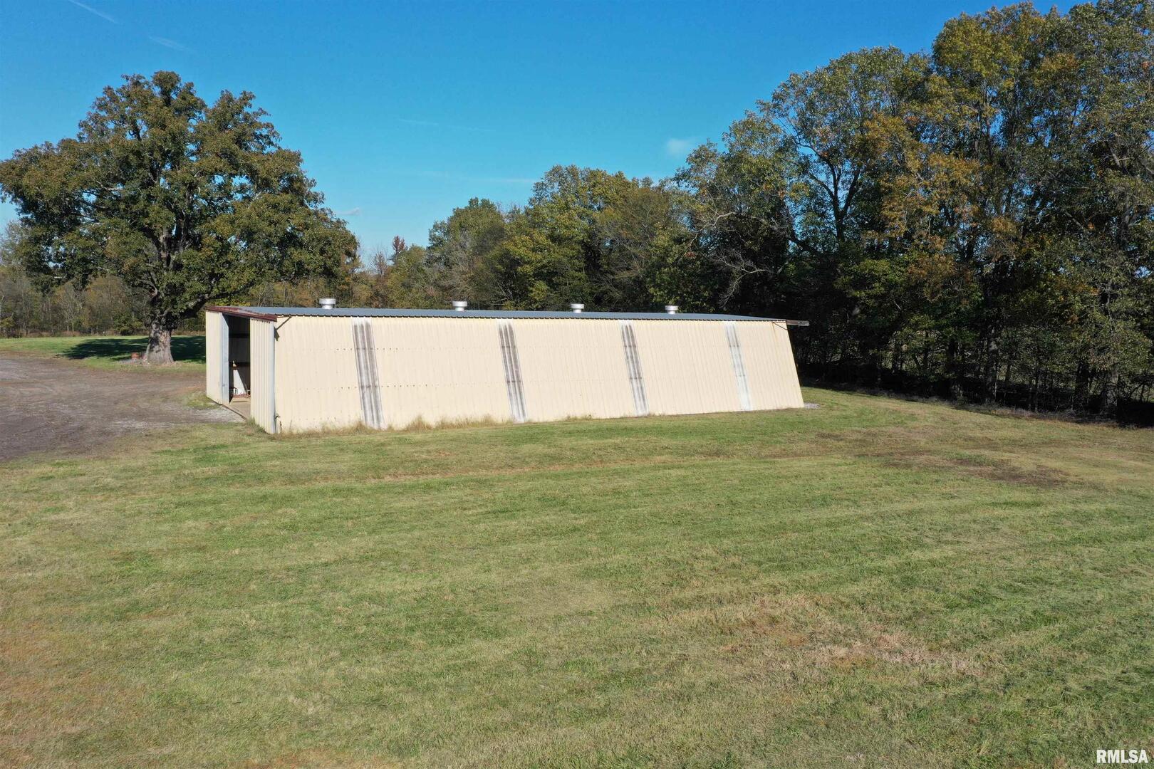 5465 Noble Road Paducah, KY 42001 - Photo 46 of 60 a view of a swimming pool with an outdoor space