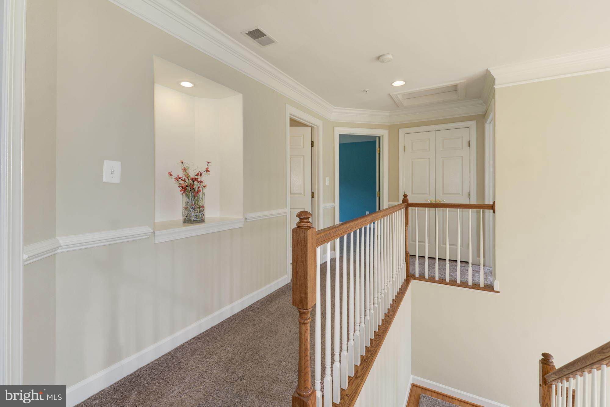 407 Potomac Ridge Drive Fort Washington, MD 20744 - Photo 14 of 30 a view of a hallway with wooden floor and windows
