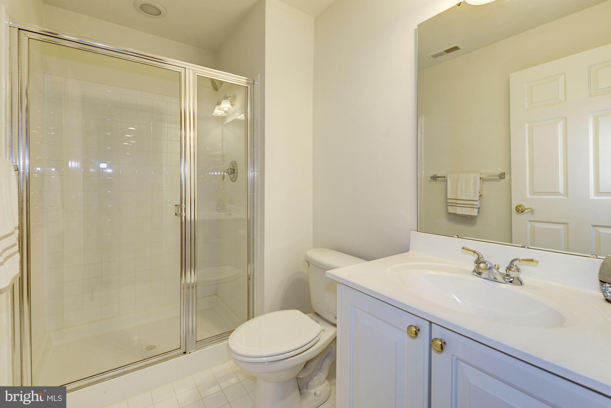 407 Potomac Ridge Drive Fort Washington, MD 20744 - Photo 25 of 30 a bathroom with a sink toilet and shower