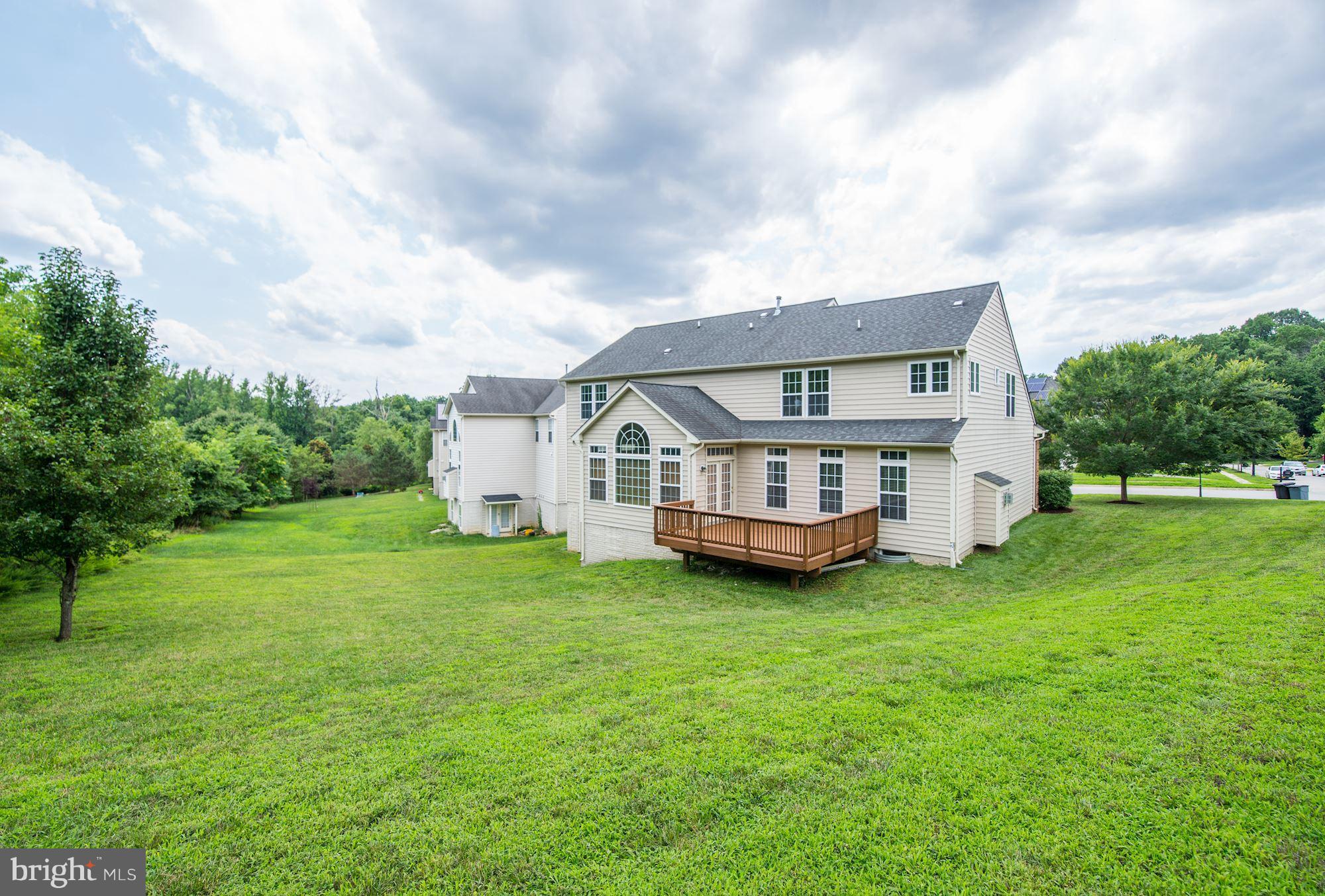 407 Potomac Ridge Drive Fort Washington, MD 20744 - Photo 27 of 30 a view of house with a big yard and large trees