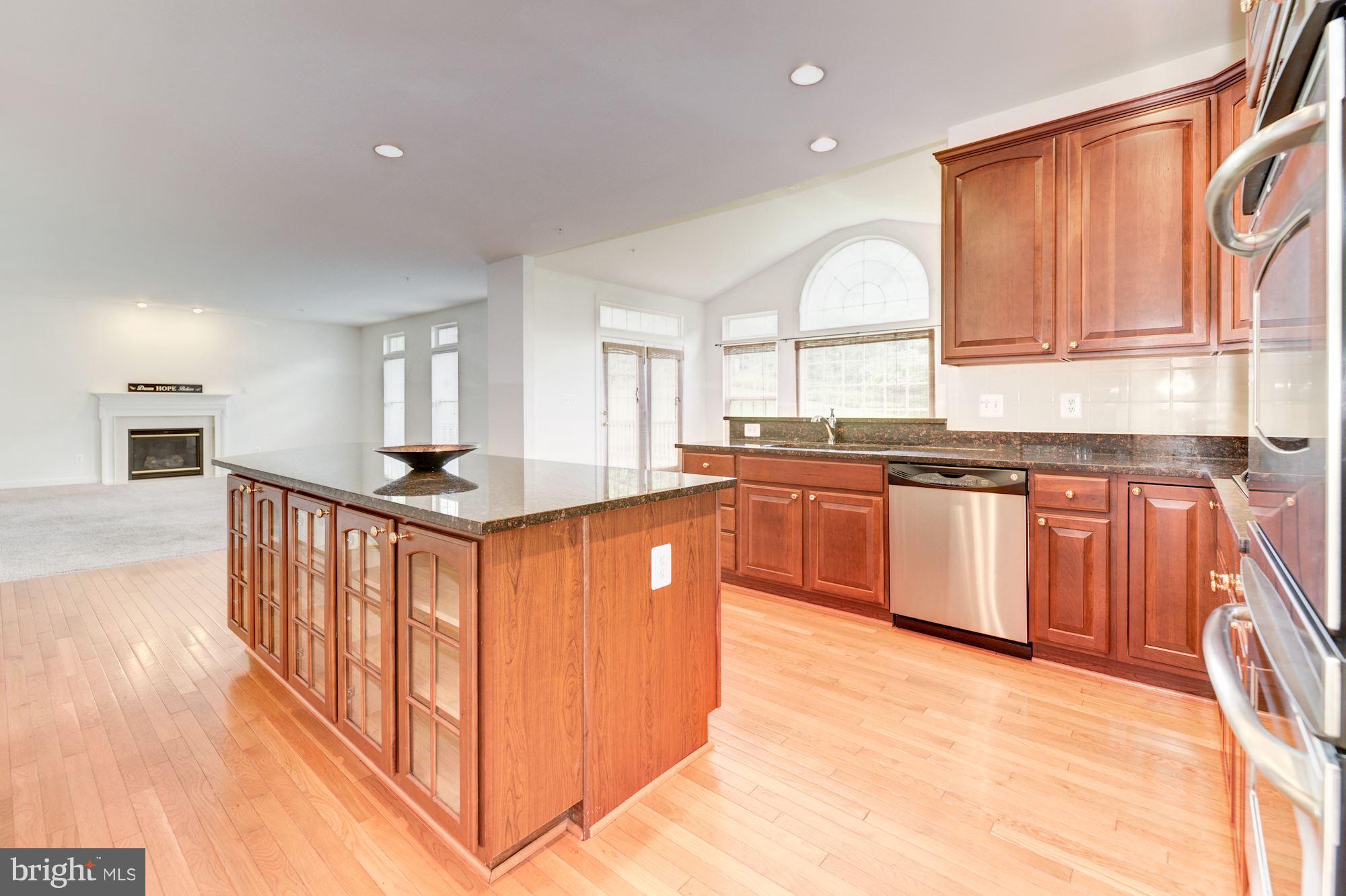 407 Potomac Ridge Drive Fort Washington, MD 20744 - Photo 6 of 30 a kitchen with stainless steel appliances granite countertop a stove a sink dishwasher and a refrigerator