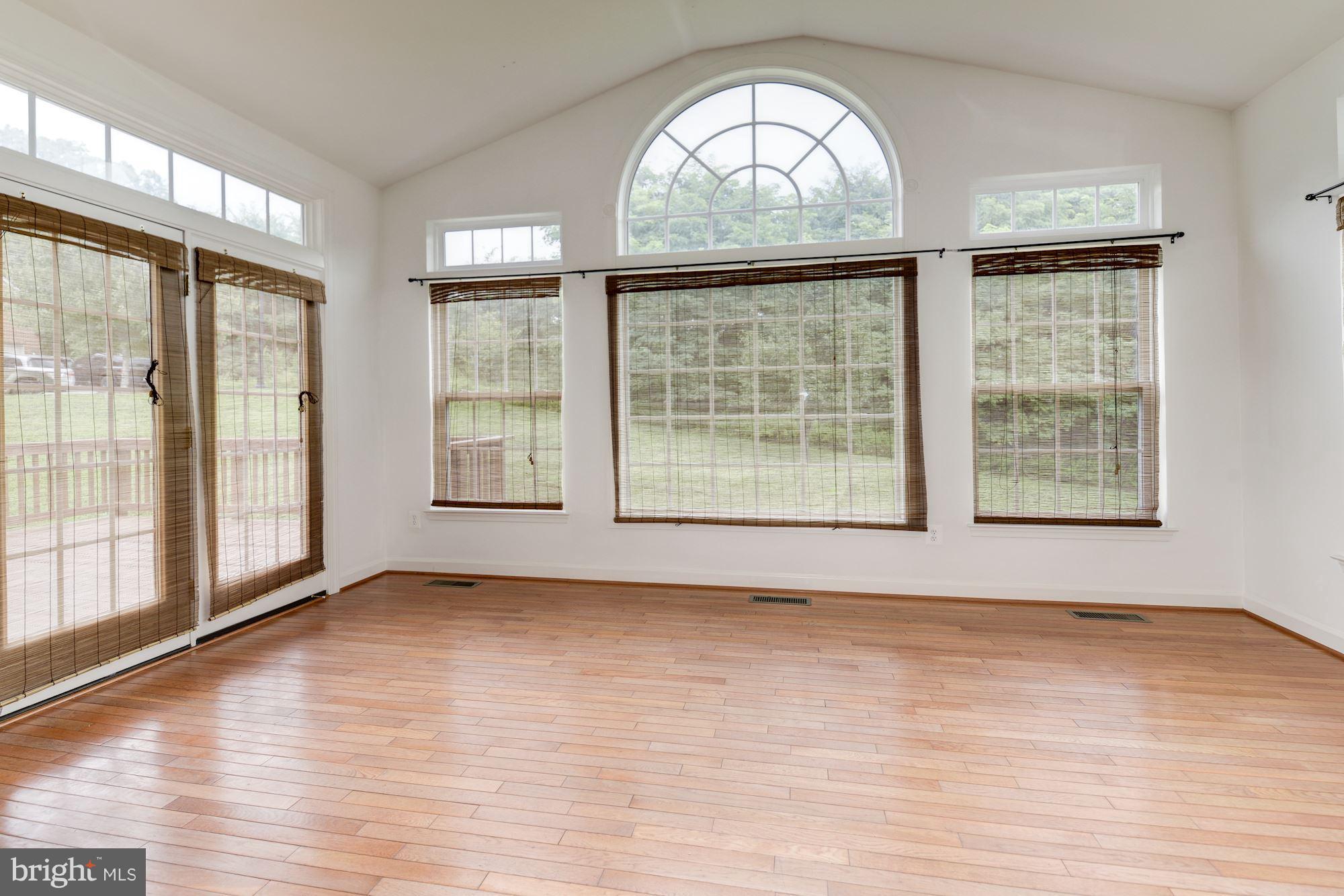 407 Potomac Ridge Drive Fort Washington, MD 20744 - Photo 7 of 30 a view of an empty room with wooden floor and a window