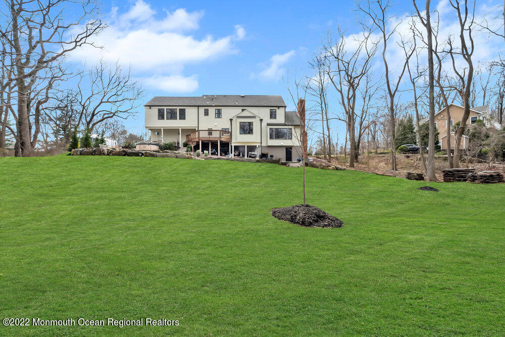 16 Saddle Ridge Road Colts Neck, NJ 07722 - Photo 54 of 59 a front view of a house with a garden