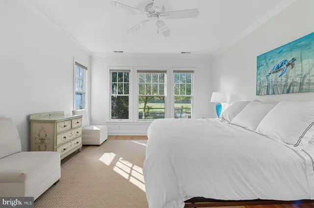 a bed room with a bed and a large window