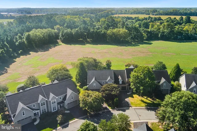 an aerial view of a house with garden space and outdoor space
