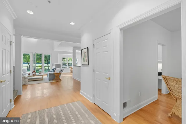 a view of a living room and dining room with wooden floor