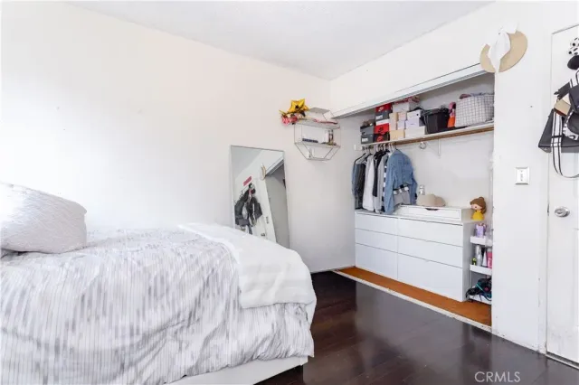 a bed sitting in a room next to a window