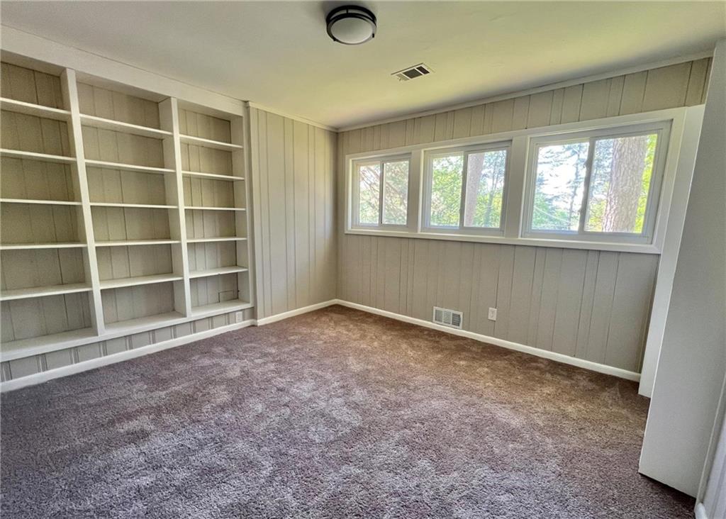 3706 Larkspur Terrace Decatur, GA 30032 - Photo 4 of 10 a view of an empty room with a window and a kitchen