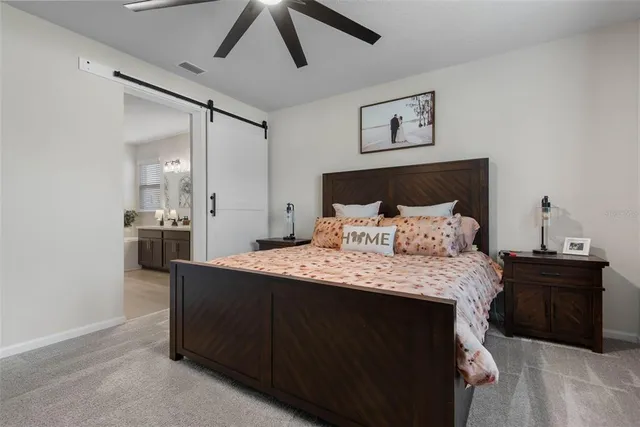 a bedroom with a bed and cabinets