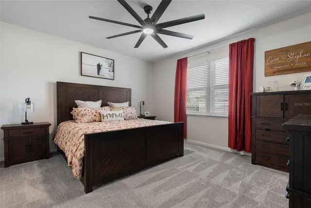 a bed room with a bed and a television