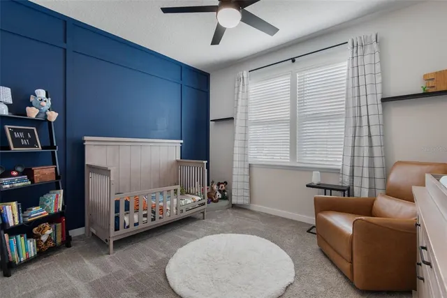a bed room with furniture and a window