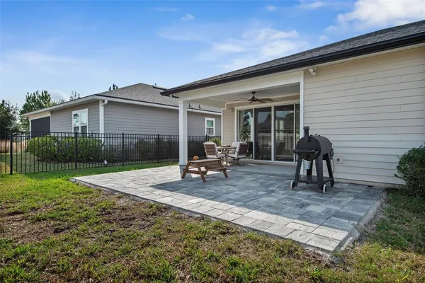 a house view with a sitting space and garden